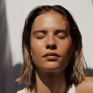 Face of young female with clear skin.